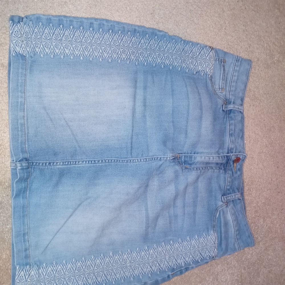 Light blue denim skirt, white embroidery on side